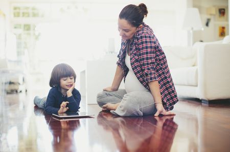 A woman and child are on the floor