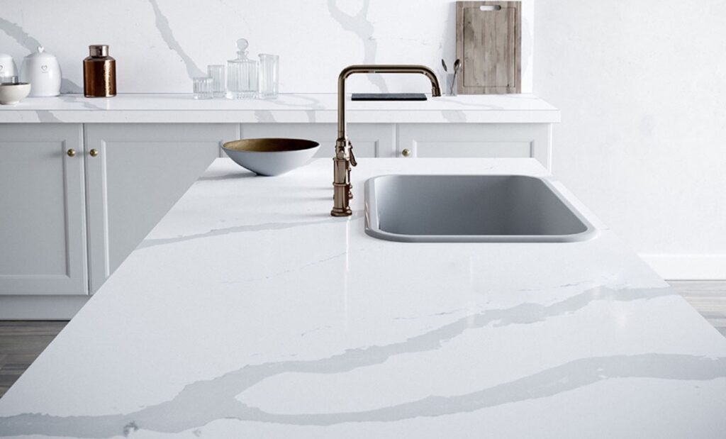 A white sink sitting on top of a counter.