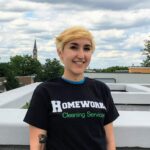 A woman standing on top of a building.