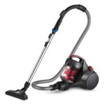 A vacuum cleaner is shown with its head on the floor.