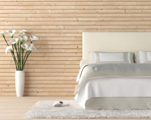 Wooden bedroom with calla lilly Interior design of wooden bedroom with bed and a vas of calla lilly flowers