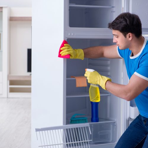 Man,Cleaning,Fridge,In,Hygiene,Concept Man,Cleaning,Fridge,In,Hygiene,Concept